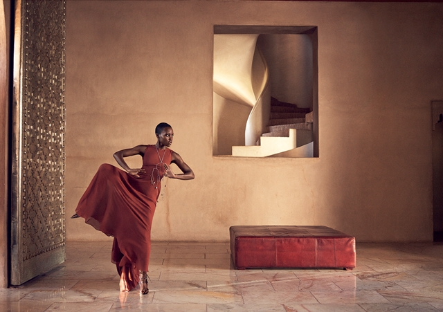 Nyong’o in the entrance hall of Marrakech’s exclusive Ksar Char-Bagh resort, a chic retreat tucked away in the city’s palm grove. Vera Wang Collection copper trapeze dress.